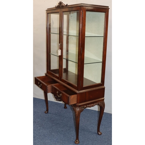 760 - A reproduction mahogany display cabinet with 2 glass panel doors, with sides enclosing glass shelves... 