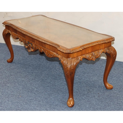 761 - A good quality reproduction walnut Long John coffee table with glass inset top, carved rim on cabrio... 