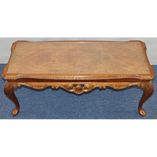 761 - A good quality reproduction walnut Long John coffee table with glass inset top, carved rim on cabrio... 