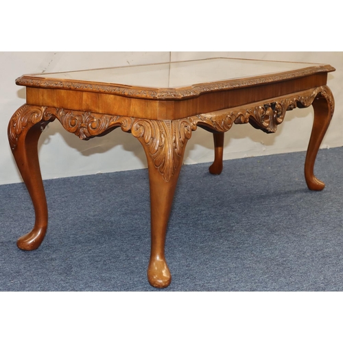 761 - A good quality reproduction walnut Long John coffee table with glass inset top, carved rim on cabrio... 