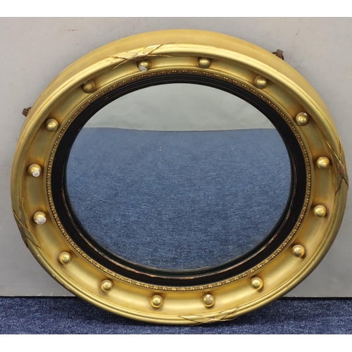 767 - A 19th/20th Century gilt convex mirror with inner ball rim, 42cm diameter (3 balls with gilt loss an... 