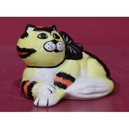 8 - A Lorna Bailey Art Deco style china figure of a resting cat on yellow, black and red ground with rib... 