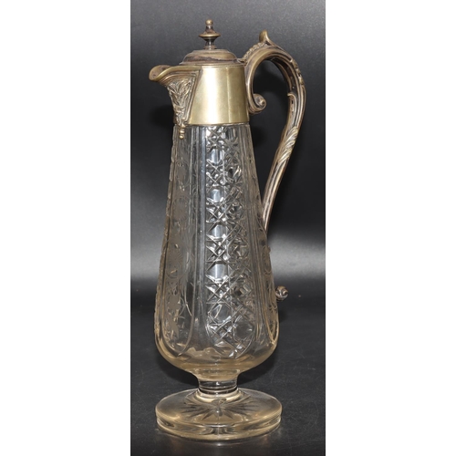 85 - A cut glass round bulbous claret jug with silver plated neck, hinged lid and scroll handle with allo... 