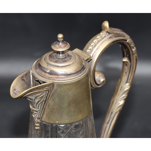 85 - A cut glass round bulbous claret jug with silver plated neck, hinged lid and scroll handle with allo... 