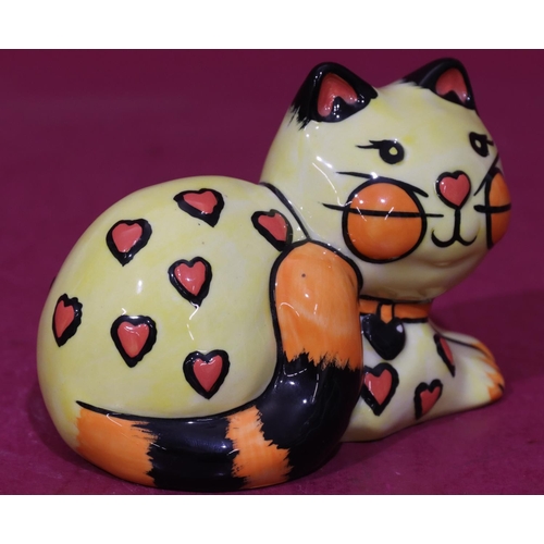 9 - A Lorna Bailey limited edition Art Deco style china figure of a resting cat on yellow, black and red... 