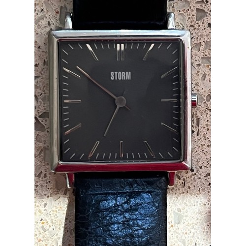 4273 - A Gents Storm slim line square stainless wristwatch with leather strap (needs new battery)