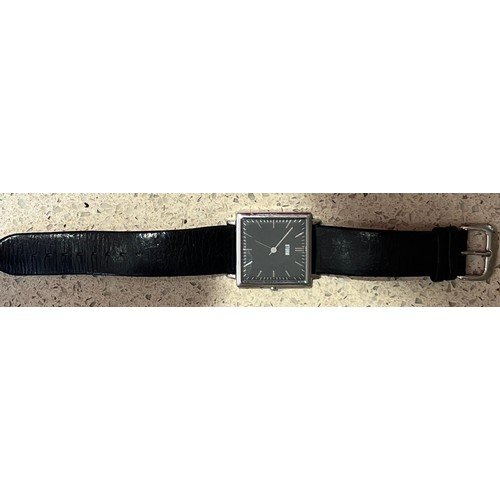 4273 - A Gents Storm slim line square stainless wristwatch with leather strap (needs new battery)