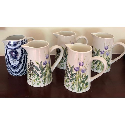 4281 - 4 matching Gisela Graham jugs  with floral pattern, 19cm high and another blue and white jug, 19cm h... 