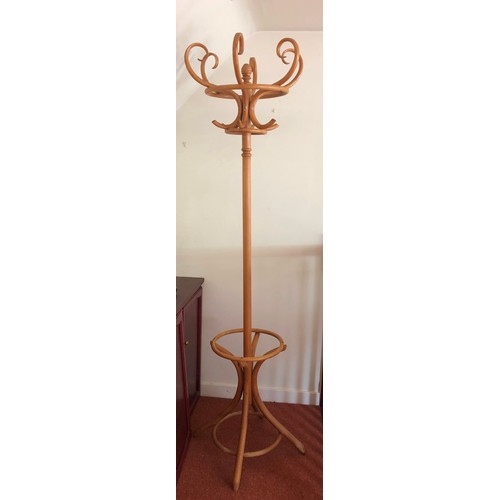 4283 - A tall light wood coat and hat stand, 205cm high, 65cm deep to base.