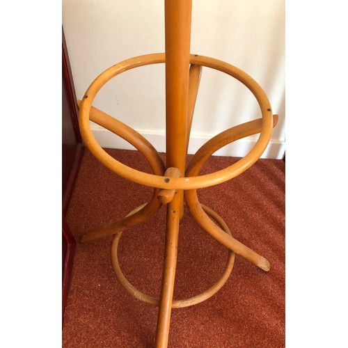 4283 - A tall light wood coat and hat stand, 205cm high, 65cm deep to base.