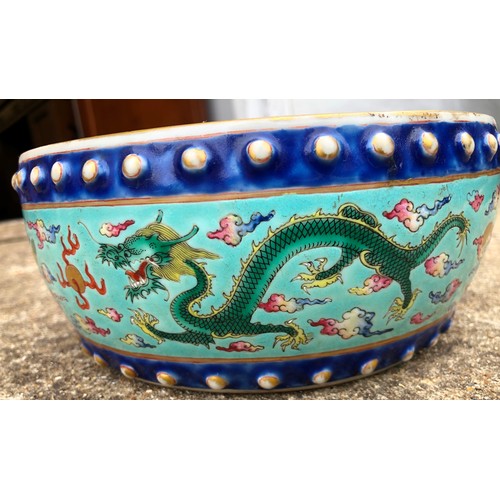 130 - A Chinese Tao-Kuang period round bulbous shaped bowl on pale turquoise ground with multi-coloured dr... 