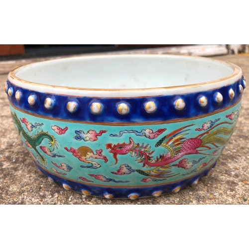 130 - A Chinese Tao-Kuang period round bulbous shaped bowl on pale turquoise ground with multi-coloured dr... 