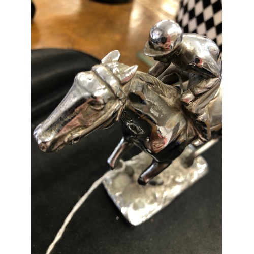 733 - A chrome car mascot in the form of a jockey on horseback, 11cm high, 13.5cm long