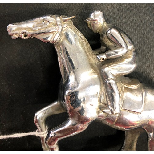 733 - A chrome car mascot in the form of a jockey on horseback, 11cm high, 13.5cm long