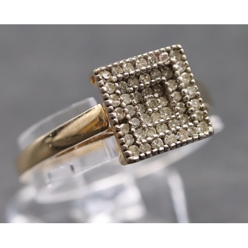 588 - A 9ct gold ladies' square cluster ring set with various diamond chips, size P/Q, 2.2 grams gross