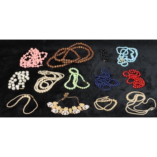 590 - A small quantity of various costume bead necklaces and a quantity of various costume earrings