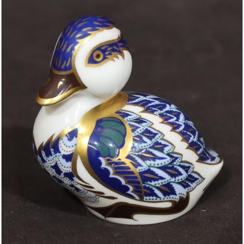 100 - A Royal Crown Derby paperweight in the form of a duck on white, blue and gilt ground, 7cm high with ... 