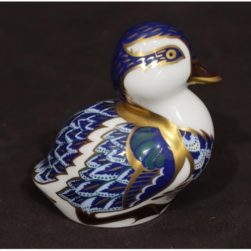 100 - A Royal Crown Derby paperweight in the form of a duck on white, blue and gilt ground, 7cm high with ... 