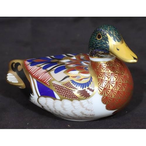 114 - A Royal Crown Derby Imari patterned paperweight in the form of a duck, with silver coloured stopper,... 