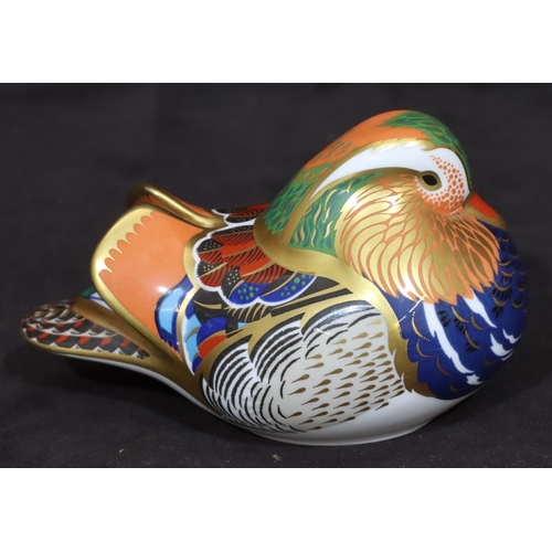 115 - A Royal Crown Derby paperweight in the form of a bird, with silver coloured stopper, 7.5cm high, 12.... 