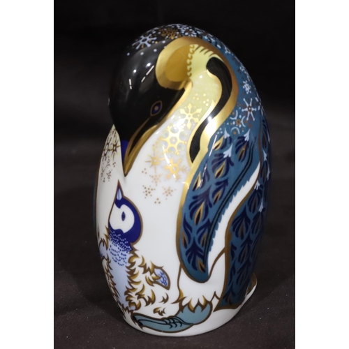 117 - A Royal Crown Derby paperweight in the form of a penguin on white and blue ground with gilt decorati... 