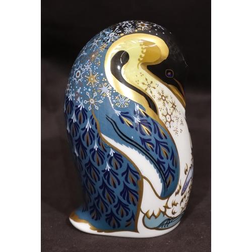 117 - A Royal Crown Derby paperweight in the form of a penguin on white and blue ground with gilt decorati... 