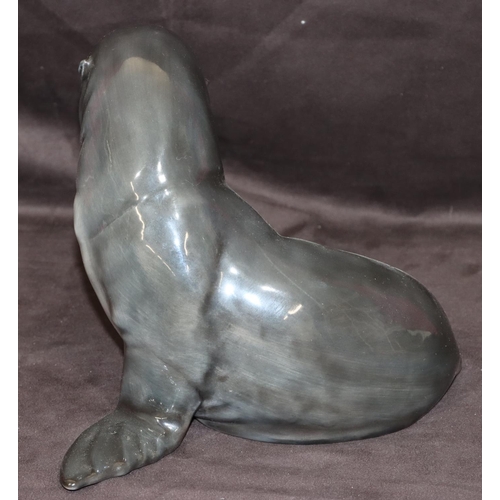 121 - A Royal Copenhagen model of a seal with pup in seated pose, numbered 090, monogrammed JI, 19cm high