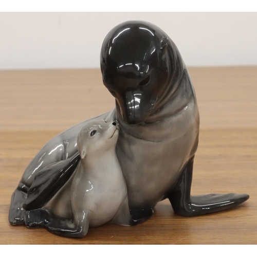 121 - A Royal Copenhagen model of a seal with pup in seated pose, numbered 090, monogrammed JI, 19cm high