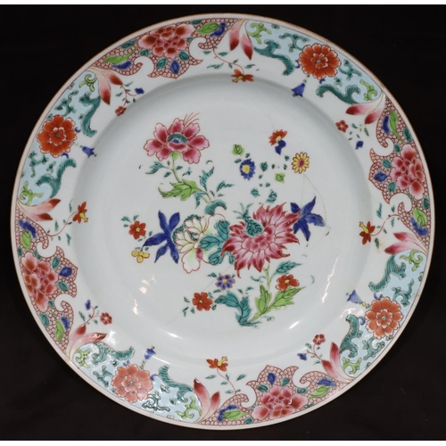 125 - An 18th Century Chinese round charger with multi-coloured floral, leaf and scroll decoration (cracke... 