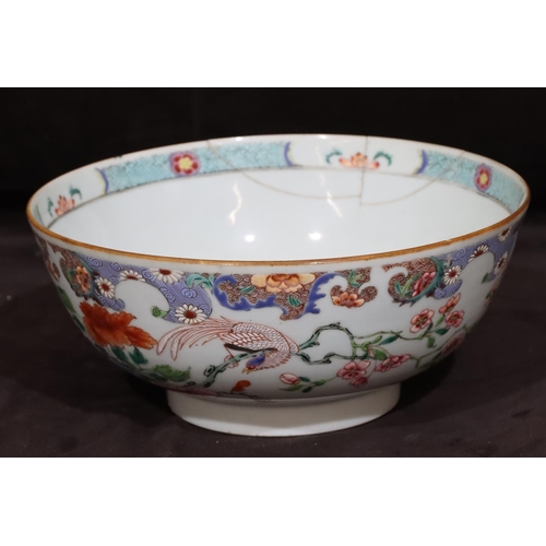 130 - A 19th Century Chinese round bowl with multi-coloured floral, leaf and scroll decoration (rim cracke... 