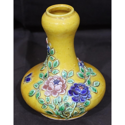 136 - An Oriental small round bulbous thin necked vase on yellow ground with raised multi-coloured floral ... 