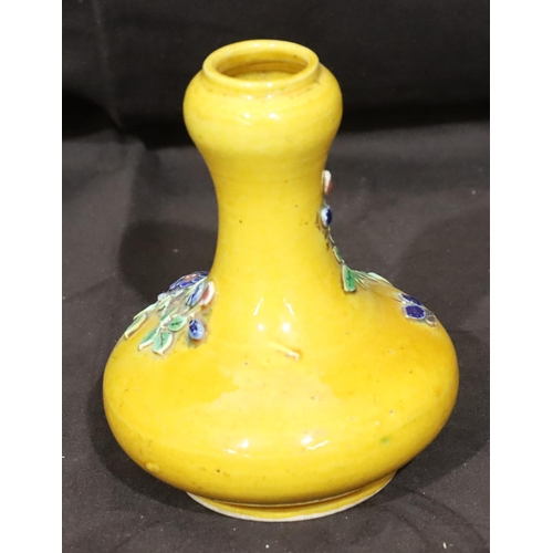 136 - An Oriental small round bulbous thin necked vase on yellow ground with raised multi-coloured floral ... 