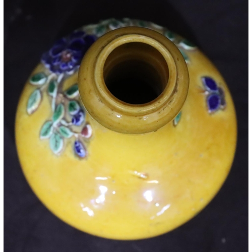 136 - An Oriental small round bulbous thin necked vase on yellow ground with raised multi-coloured floral ... 