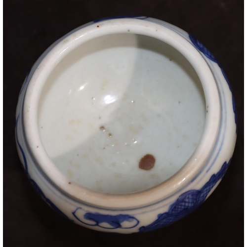 138 - A 19th Century small round bulbous shaped pot on blue and white ground with dragon decoration, on ro... 