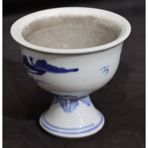 140 - A 19th Century Chinese small round bulbous trumpet shaped cup on blue and white ground depicting lan... 