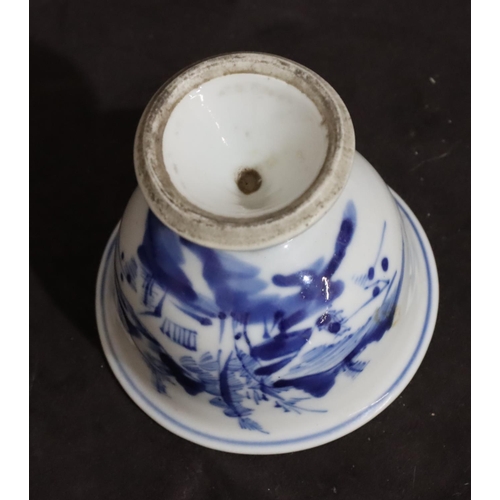 140 - A 19th Century Chinese small round bulbous trumpet shaped cup on blue and white ground depicting lan... 