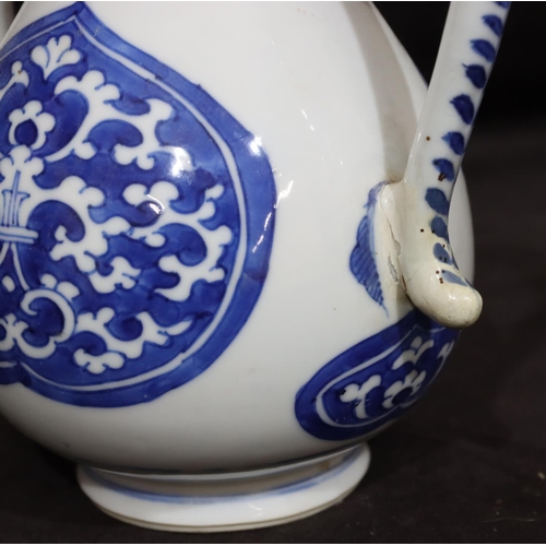 141 - An Oriental round bulbous shaped teapot on blue and white ground with scroll decoration, with cover,... 