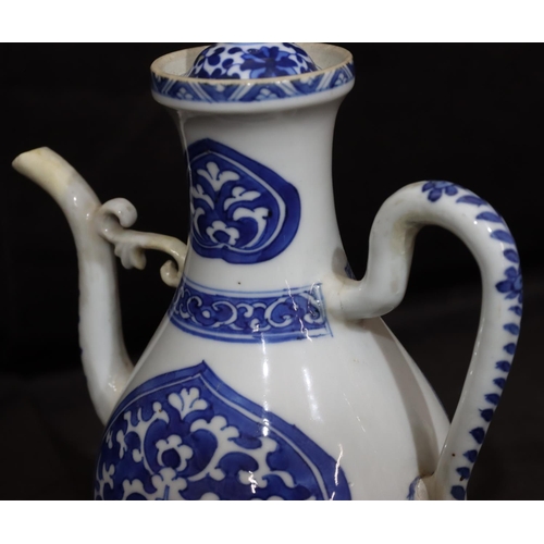 141 - An Oriental round bulbous shaped teapot on blue and white ground with scroll decoration, with cover,... 