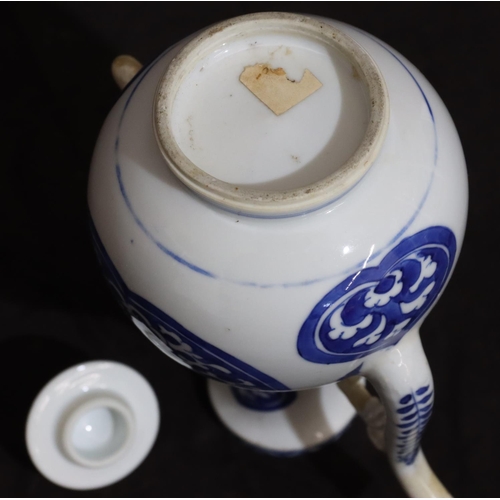 141 - An Oriental round bulbous shaped teapot on blue and white ground with scroll decoration, with cover,... 