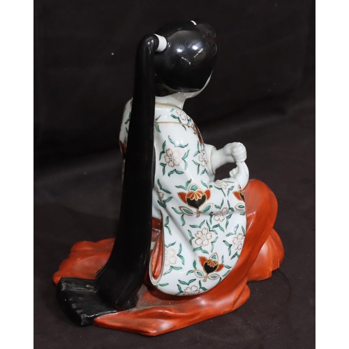 145 - A 19th/20th Century Oriental figure of a kneeling Geisha girl, 23cm high