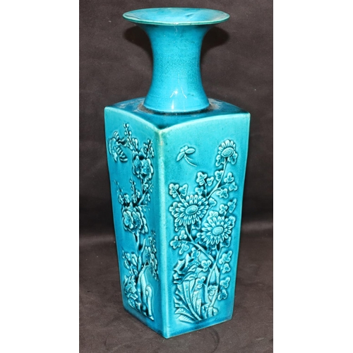 146 - A 19th Century Oriental square thin necked trumpet shaped vase on turquoise ground with raised flora... 