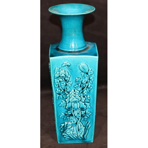 146 - A 19th Century Oriental square thin necked trumpet shaped vase on turquoise ground with raised flora... 