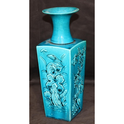 146 - A 19th Century Oriental square thin necked trumpet shaped vase on turquoise ground with raised flora... 