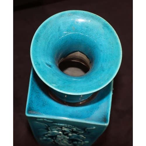 146 - A 19th Century Oriental square thin necked trumpet shaped vase on turquoise ground with raised flora... 