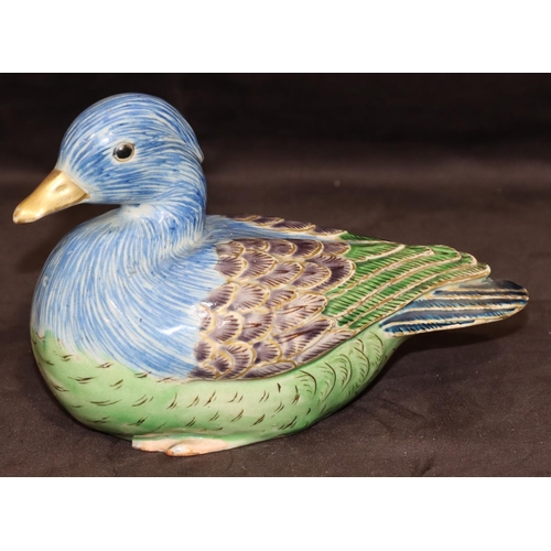 147 - An Oriental glazed earthenware figure of a bird on blue, purple and green ground, 17cm long, 11.5cm ... 