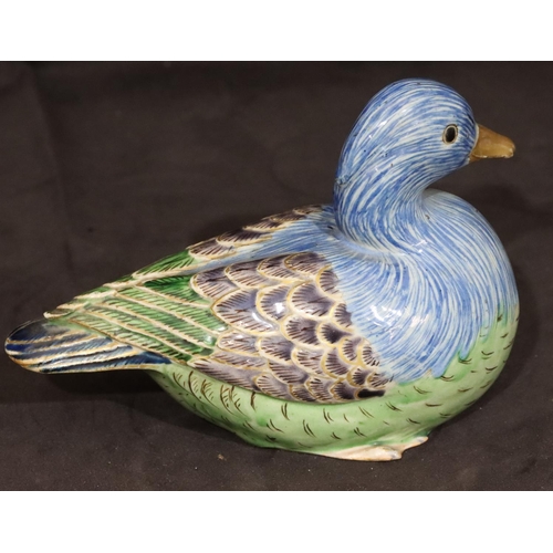 147 - An Oriental glazed earthenware figure of a bird on blue, purple and green ground, 17cm long, 11.5cm ... 