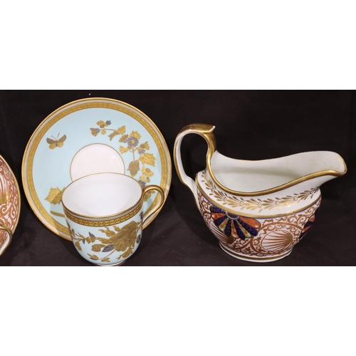 149 - A 19th Century oval milk jug on Imari pattern ground with gilt decoration, a matching cup and saucer... 