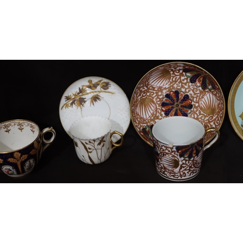 149 - A 19th Century oval milk jug on Imari pattern ground with gilt decoration, a matching cup and saucer... 