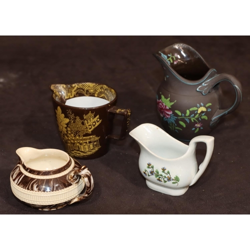 15 - A 19th Century Basalt round bulbous shaped jug with multi-coloured raised enamelled floral and leaf ... 