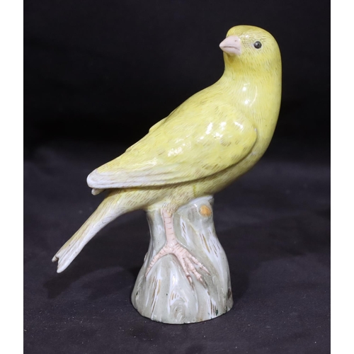 151 - A 19th Century Meissen figure of a yellow bird perched upon trunk (trunk restored), 10cm high